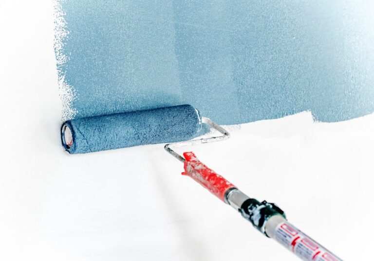 Paint roller with fresh blue paint
