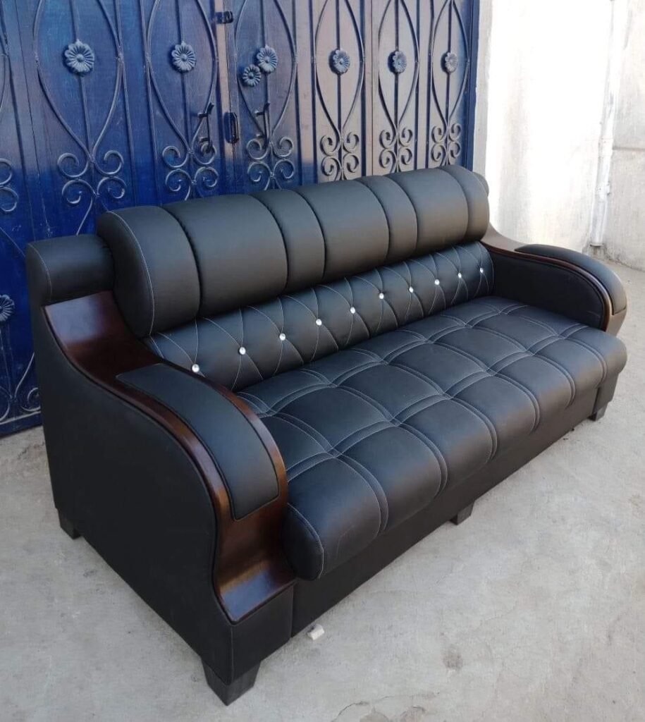 Custom black sofa with wooden arms