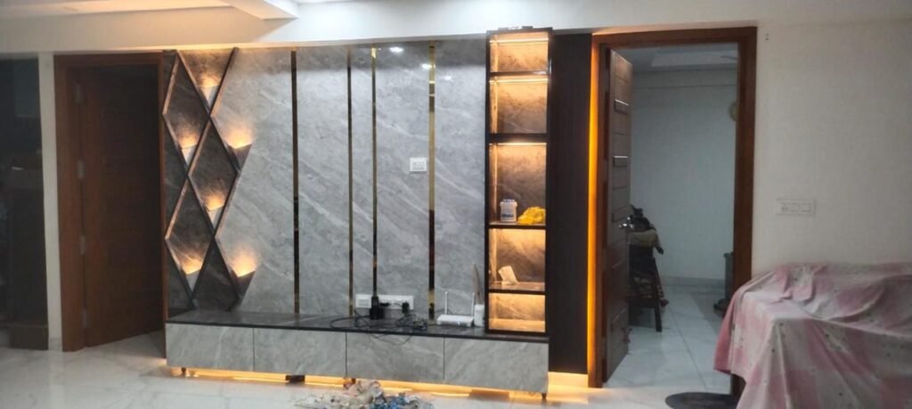 TV unit wall in marble with gold inlay and lighting